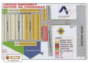 Amolik Residency Sector 86 Faridabad layout map showing residential plots, commercial shops, community site, green area, utility infrastructure and 9 meter internal roads